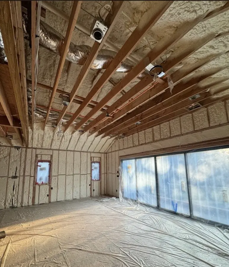 Interior walls and ceiling insulated with spray foam during new construction in Daytona Beach Shores